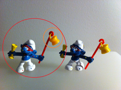 This ads shows 2 variants of Carnival Smurf and is offering the one circled in RED. Excellent condit...