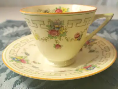 The Royal Doulton Teacup & Saucer Set is a two-piece floral bone china set from England, dating back...