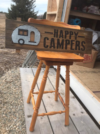 Solid swivel stool  ,Happy Camper sign, small luggage & toad bag