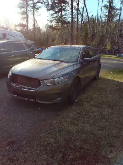 Have a 2013 Ford Taurus works good, solid car, needs a grill, reason for selling is health reasons,...