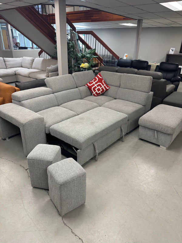 Sectional with pullout, adjustable headrest, storage and 2 stool in Couches & Futons in Kamloops