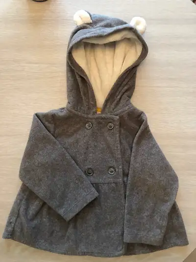 Transcona near club regent casino for pick up. Fancy grey hooded sweater / jacket. Size 12 months. C...