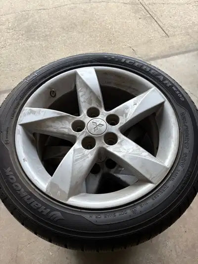 For sale is a set of used Mitsubishi winter tires mounted on rims, size 225/50R17 98V, ready to tack...