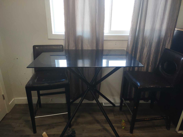 Bar height table and two chairs. in Dining Tables & Sets in Winnipeg
