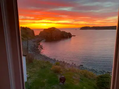 Oceanfront home in Chance Cove, NL, with stunning views of the bay from large back deck, kitchen and...