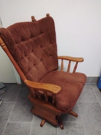 Swivel rocking chair with cushions in good condition