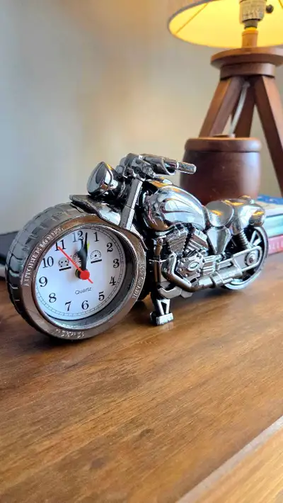 This unique alarm clock is designed to look like a motorcycle. It is brand new and never been used....