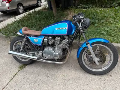 1980 Suzuki GS750L cafe racer style with lots of custom work completed on it. The bike runs smoothly...