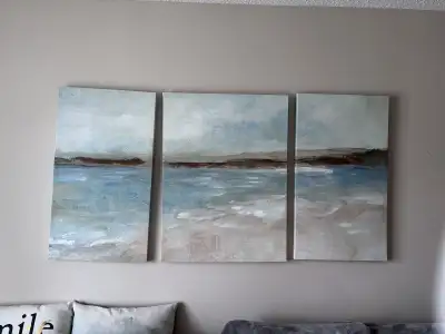 Add a touch of serene artistry to your living space with this captivating three-piece wall art set,...