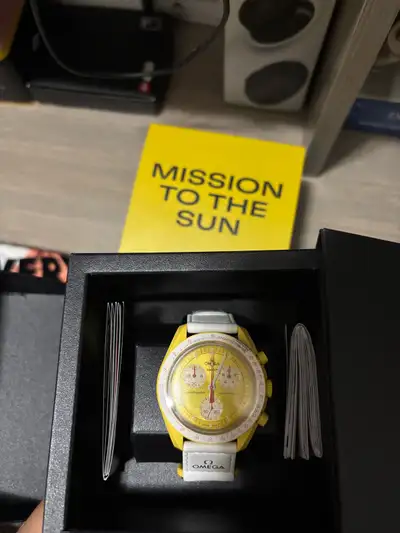 Selling an Omega Moonswatch Mission to the Sun watch! This stylish timepiece features a vibrant yell...