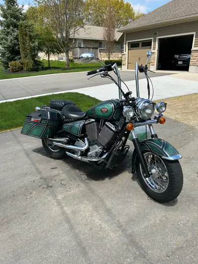 Selling my 2001 v92 custom paint job candy green mustang seat 16” meat hooks Barnett cables Harley b...