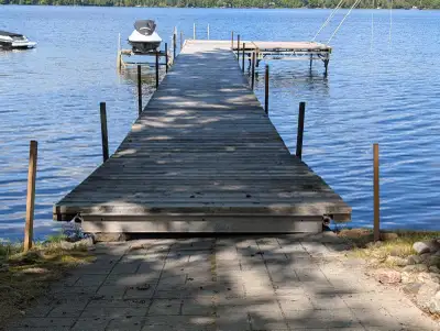 Heavy duty pole dock. 6, 10ft x 5ft lengths. 1, 7.5ft x 5ft ramp, 12ft x 16 ft patio. Boards are all...