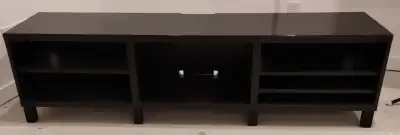 Ikea Black TV Stand, measures 5 feet 11 inches by 1 foot, 4 inches deep, by 1 foot 7 1/2 inches high...