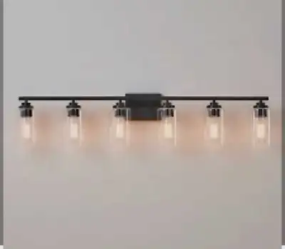 Add a touch of modern elegance to your bathroom with this stylish 6 Light Bathroom Vanity Light. Thi...