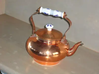 Copper Tea Pot with blue and white porcelain handle and knob, a nice decorative piece (displayed or...