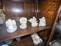Four little angel figurines