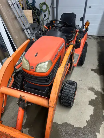 I'm selling a used Kubota BX2360 diesel 4x4 acreage tractor, perfect for various tasks around your p...