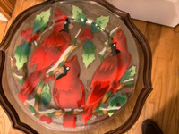 Three Beautiful Cardinals Adorning a Glass Plate