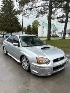 Own a piece of rally history with this eye-catching 2004 Subaru WRX STI, boasting a powerful engine,...