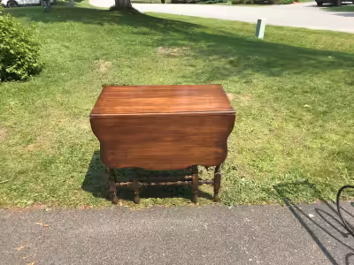 Hardwood/cherry gate-leg table with hidden centre leaf. Dimensions: Length 21" leaves down, 53" both...