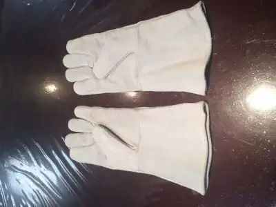 All leather oven mitt style welding gloves 14" long, nice soft leather. All together awesome welding...