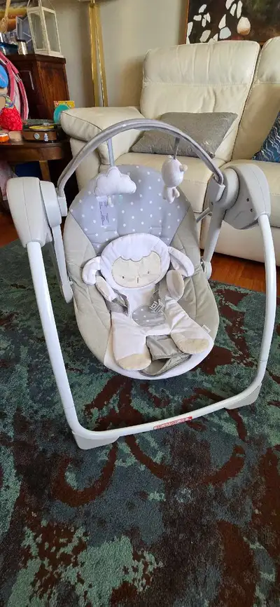 Ingenuity brand Baby Lamb Swing Chair in mint condition. Battery operated with different speed and m...