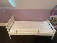 IKEA toddler bed for sale. Includes mattress and safety bar