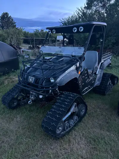 Comes with tracks and tires. Tires stored inside, very little use. Seat could use new covers 1745 km...