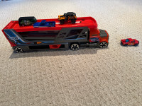 Hot wheels double decker car carrier - shoots cars out the front