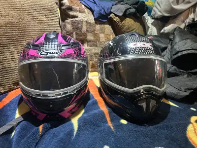 These two pre-owned snowmobile helmets, one by GMAX and the other by CKX, are in great condition and...