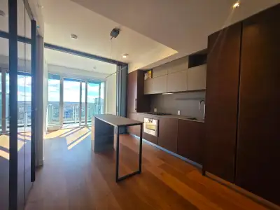 Never-lived-in 1-bedroom + den (482 sq ft interior + 40 sq ft balcony) on the 31st floor of 2 Burrar...