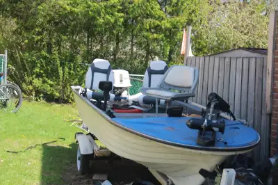 Fishing Boat 14 1/2 ft fiberglass Boat with 25hp short shaft tiller, all so comes with 65 Lb Motor G...