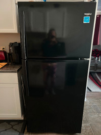 Black full size fridge and stove