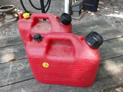 Two small plastic gas cans. No filler nozzles.