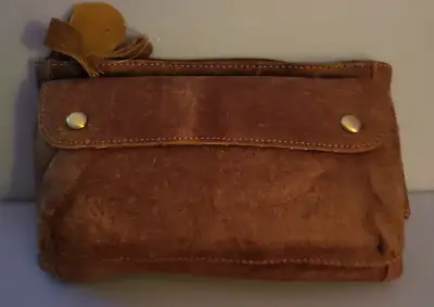 New in box. This waist pack has a total of 4 compartments, the main bag are for wallet, mobile phone...