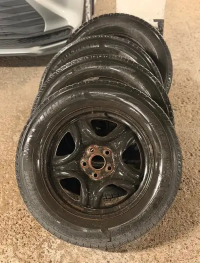 Set of 4 winter tires, size 225/65R17, in fair condition.