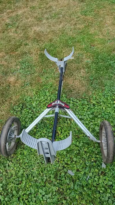 This is a used Roll King golf caddy with a three-wheel design for smooth maneuverability on the cour...