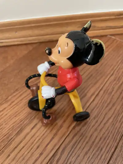 1977 Mickey Mouse on bicycle. Made in Hong Kong. Bicycle still works. Pretty good condition consider...