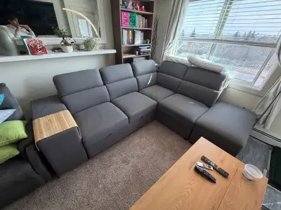 Grey right hand facing sectional with pull out bed, View more