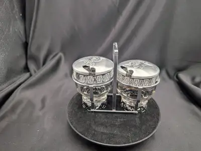2 Glass dishes with aluminum lids and steel caddy/carrying rack Lids feature a rose pattern Glass di...