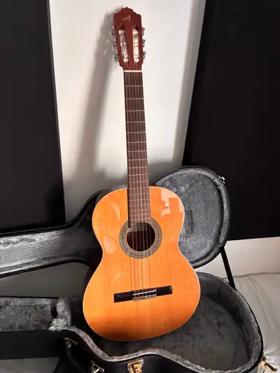 Classical guitar with pickup and case, View more