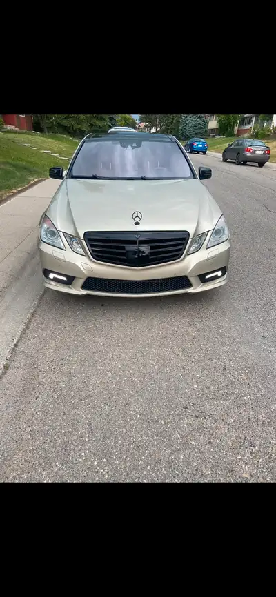 2011 Mercedes e550 champagne color with black accents 4 matic Clean active no issues Has a ding on t...