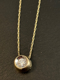 .25 Diamond bezel pendant. And chain 