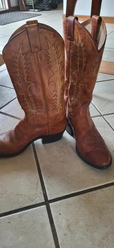Original Tony Lama leather cowboy boots. Size 9EE. Leather soles. Slightly used. If it's listed, it'...