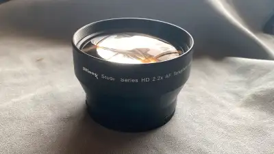 2x teleconverter front of lens, View more