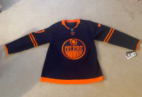 Paul Coffey a signed Oilers Jersey