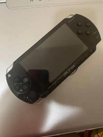 Selling my used Sony PSP 1000, a portable gaming console with a vibrant screen for gaming on the go....