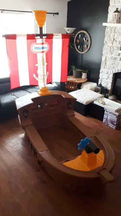 Little Tikes pirate ship bed. All lights work. Some damage from my dog chewing it when he was a pup!...