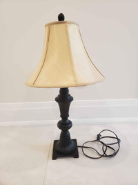 Single brown lamp with tan lamp shade