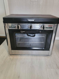 Camp chef propane oven/stove .  Never Used